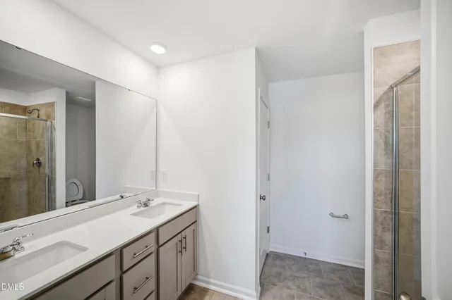 a view of a hallway with wooden shelves
