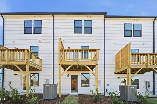 a bedroom with a bed and painting on the wall