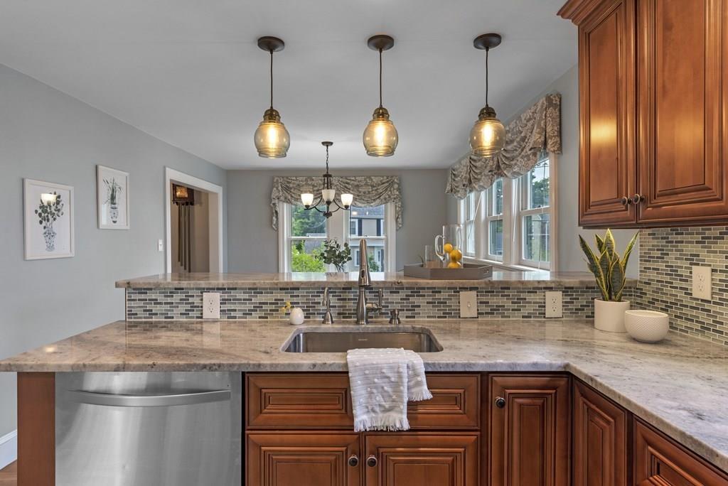 17 Lodge Road Newton, MA 02465 - Photo 8 of 31 a kitchen with stainless steel appliances granite countertop a sink a stove and a wooden floors