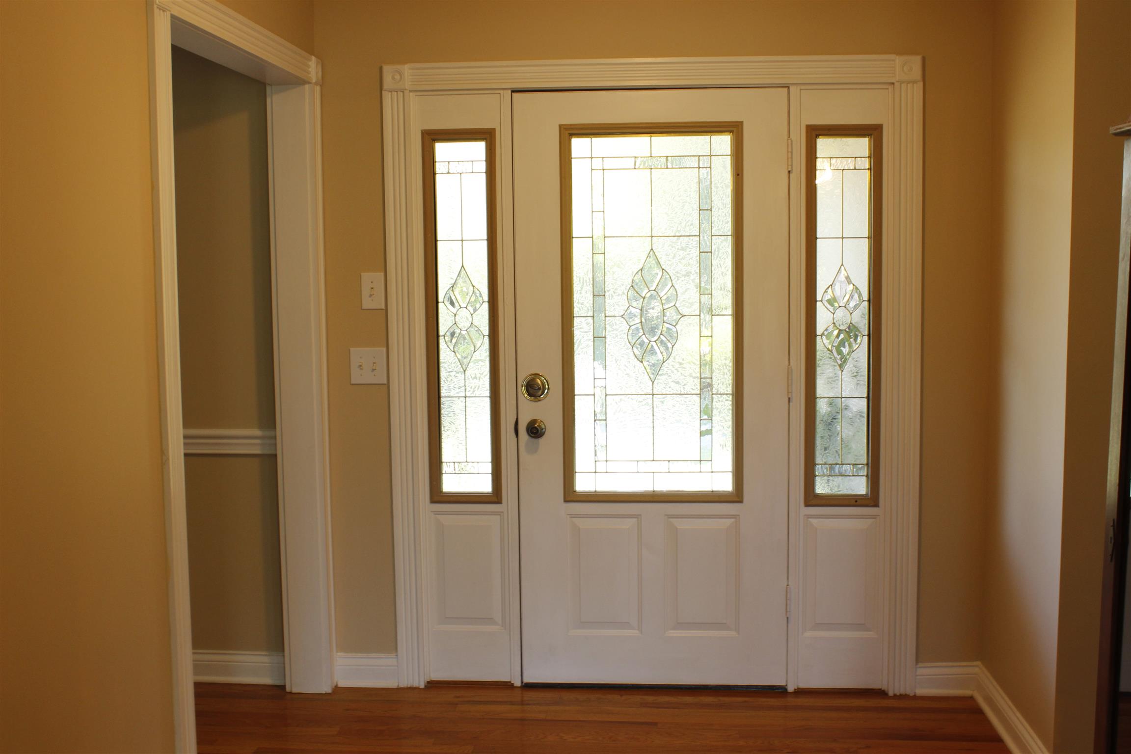 4634 Matthews Road Cedar Hill, TN 37032 - Photo 3 of 23 a view of an empty room with wooden floor and a window