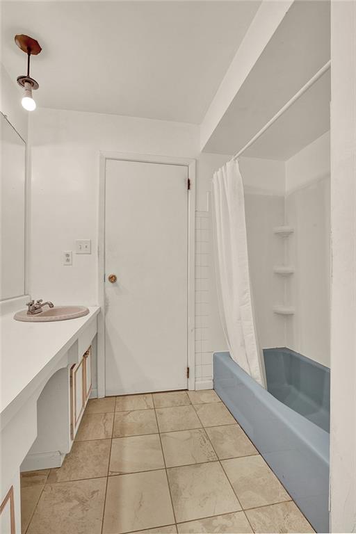 503 Virginia Drive Rostraver Township, PA 15012 - Photo 11 of 37 a bathroom with a sink and a mirror