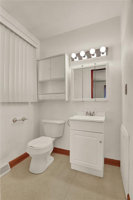 503 Virginia Drive Rostraver Township, PA 15012 - Photo 12 of 37 a bathroom with a sink toilet and a mirror
