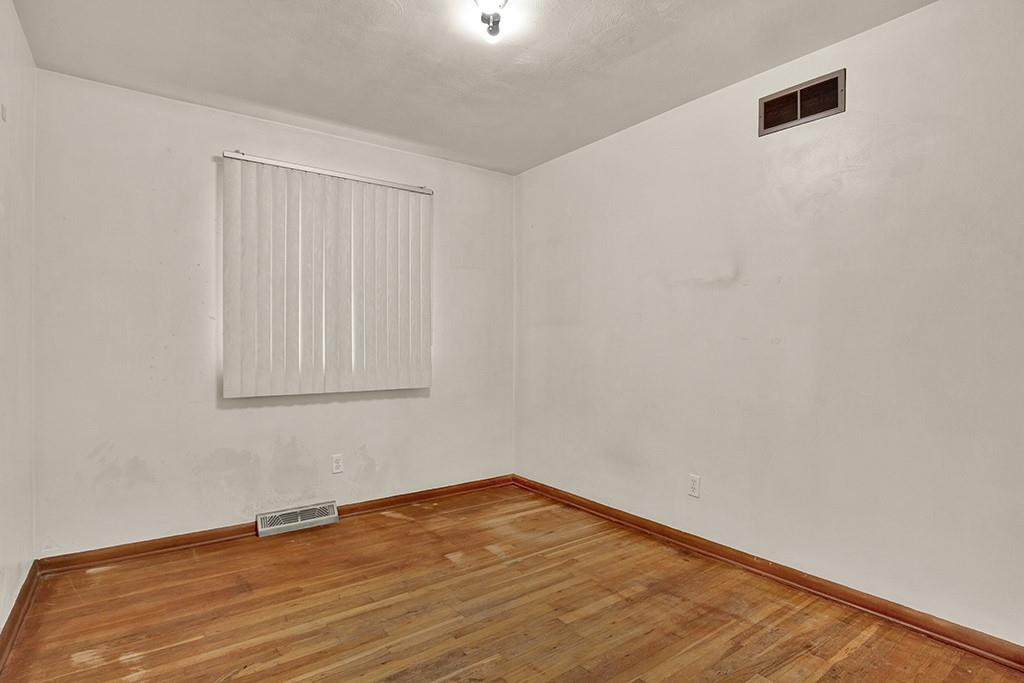 503 Virginia Drive Rostraver Township, PA 15012 - Photo 19 of 37 a view of empty room with wooden floor