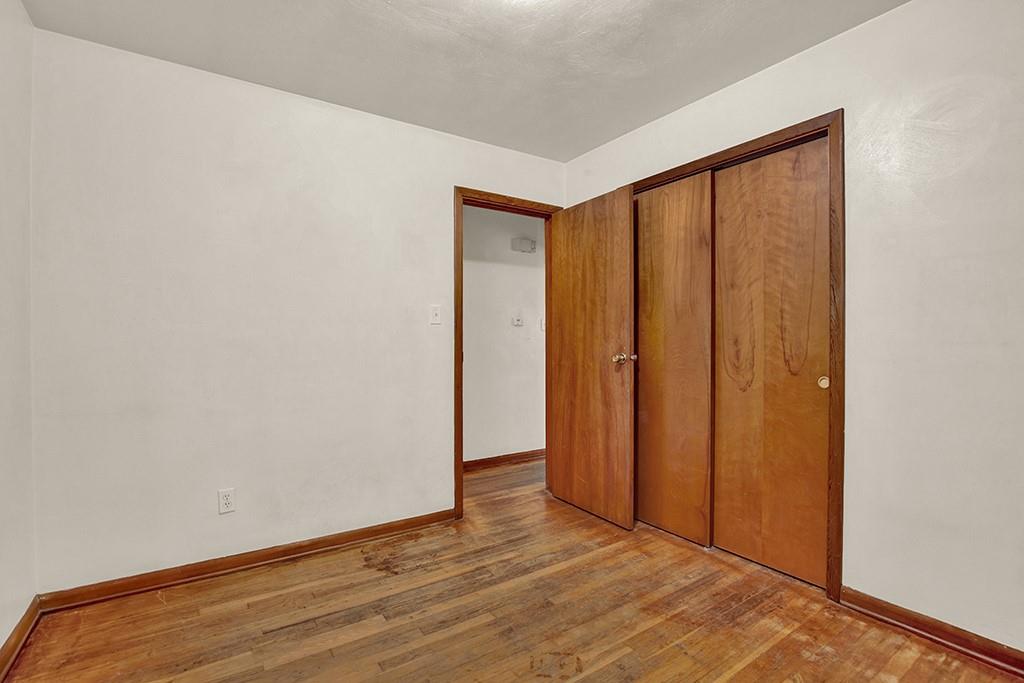 503 Virginia Drive Rostraver Township, PA 15012 - Photo 20 of 37 a view of an empty room with wooden floor