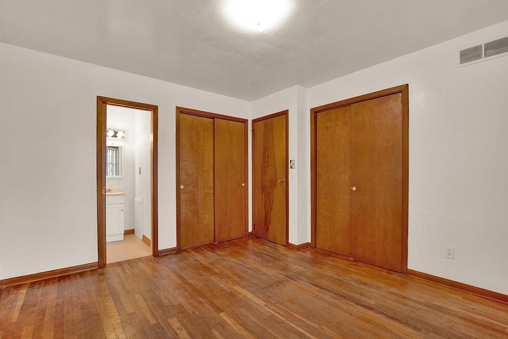503 Virginia Drive Rostraver Township, PA 15012 - Photo 3 of 37 a view of an empty room with wooden floor and a window