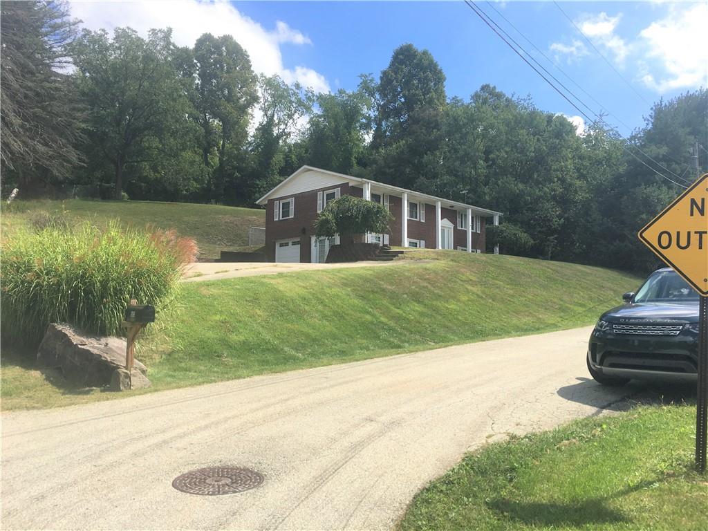 503 Virginia Drive Rostraver Township, PA 15012 - Photo 36 of 37 a front view of a house with a yard