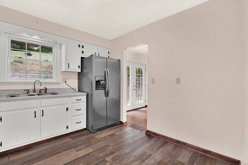 503 Virginia Drive Rostraver Township, PA 15012 - Photo 5 of 37 a kitchen with stainless steel appliances a refrigerator and a sink