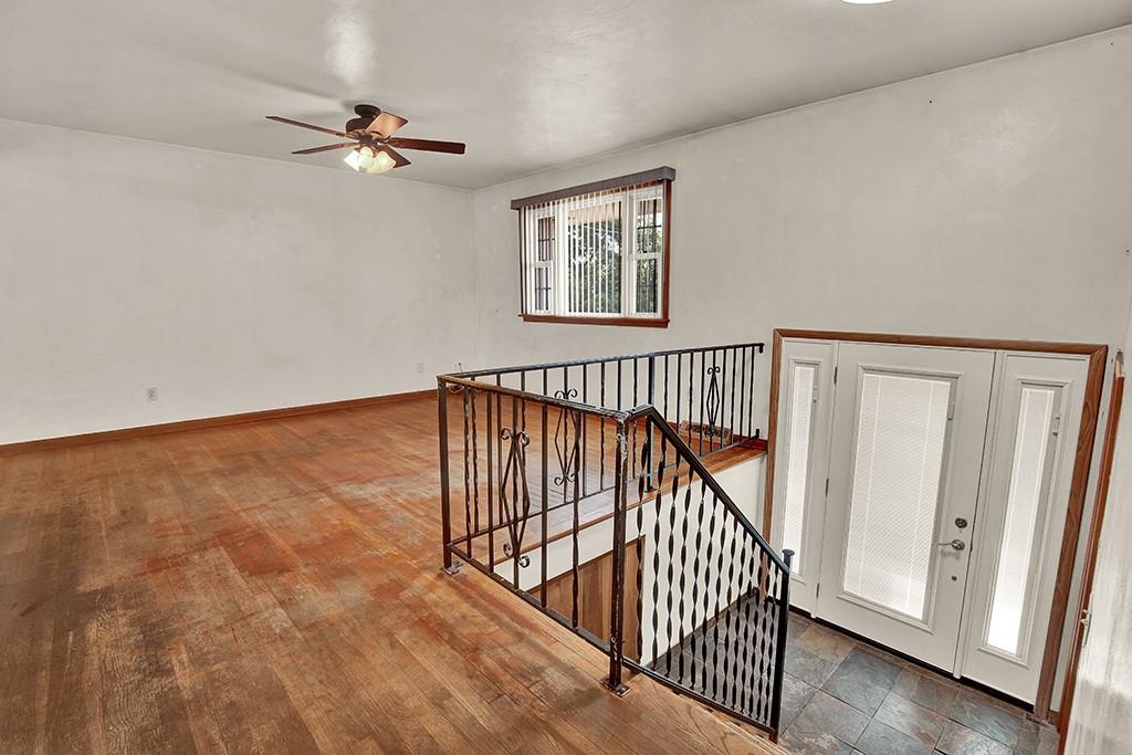 503 Virginia Drive Rostraver Township, PA 15012 - Photo 9 of 37 a view of staircase with wooden floor and fan