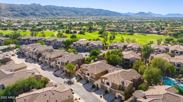 a view of a city with mountains in the background