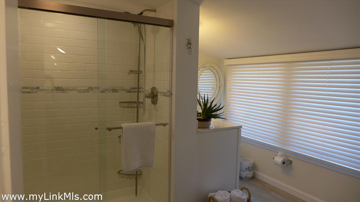 34 Windemere Road Oak Bluffs, MA 02557 - Photo 24 of 44 a bathroom with a shower and a sink