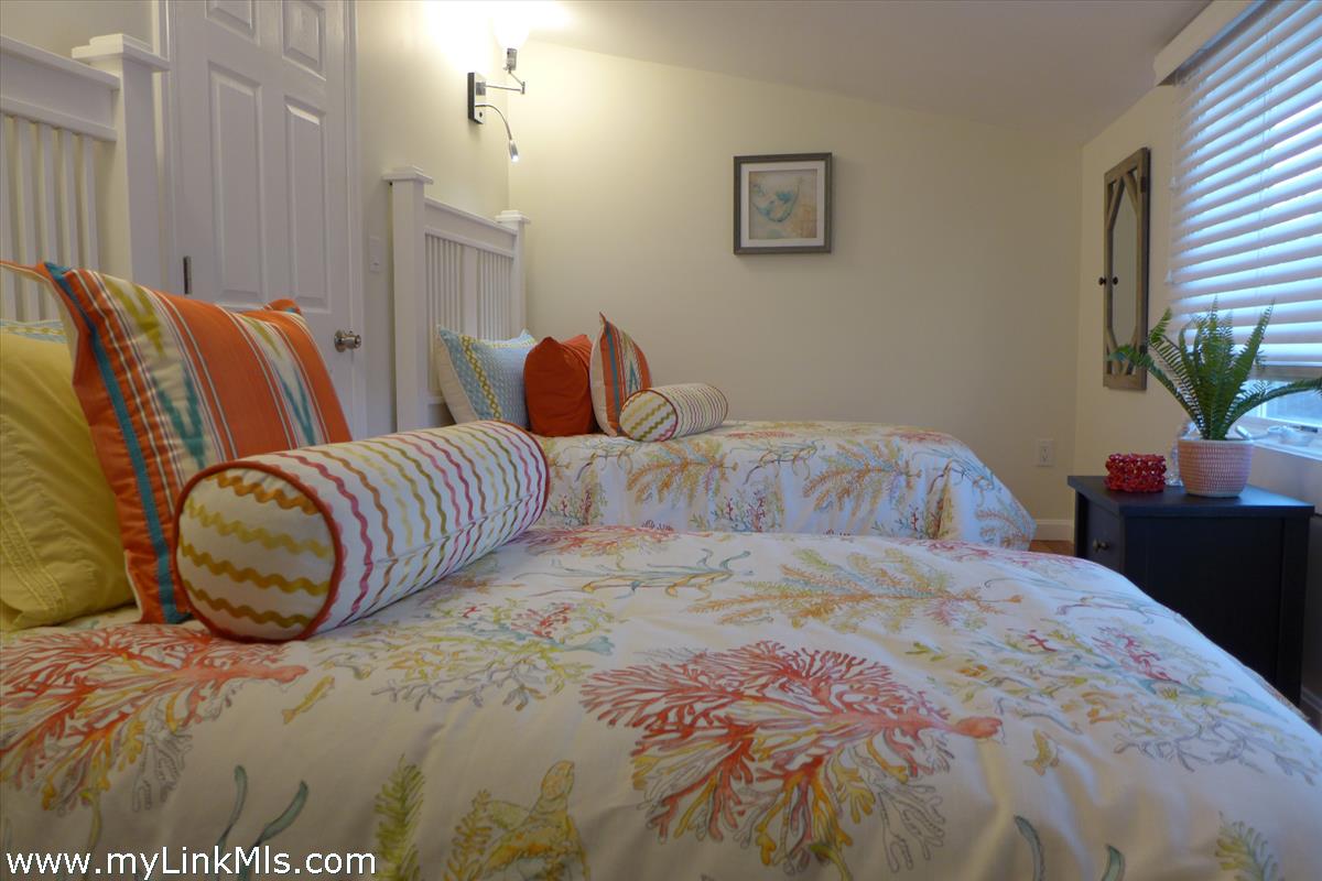 34 Windemere Road Oak Bluffs, MA 02557 - Photo 26 of 44 a bedroom with a bed and window