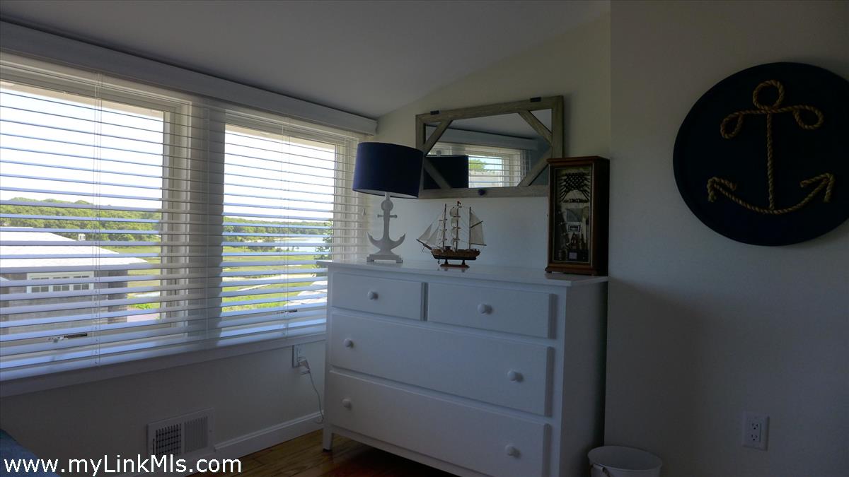 34 Windemere Road Oak Bluffs, MA 02557 - Photo 28 of 44 a bathroom with a sink and a mirror