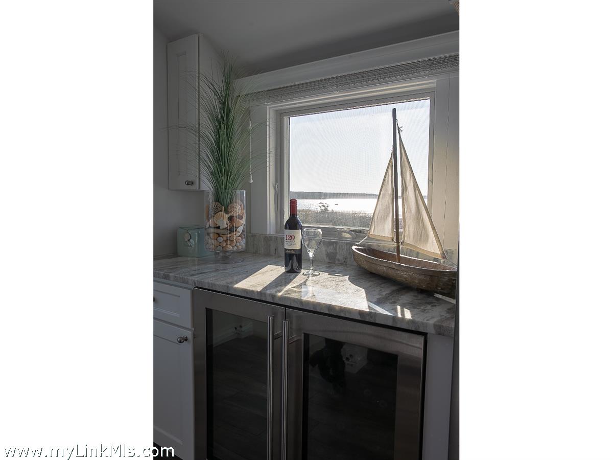 34 Windemere Road Oak Bluffs, MA 02557 - Photo 10 of 44 a kitchen with a sink and a window