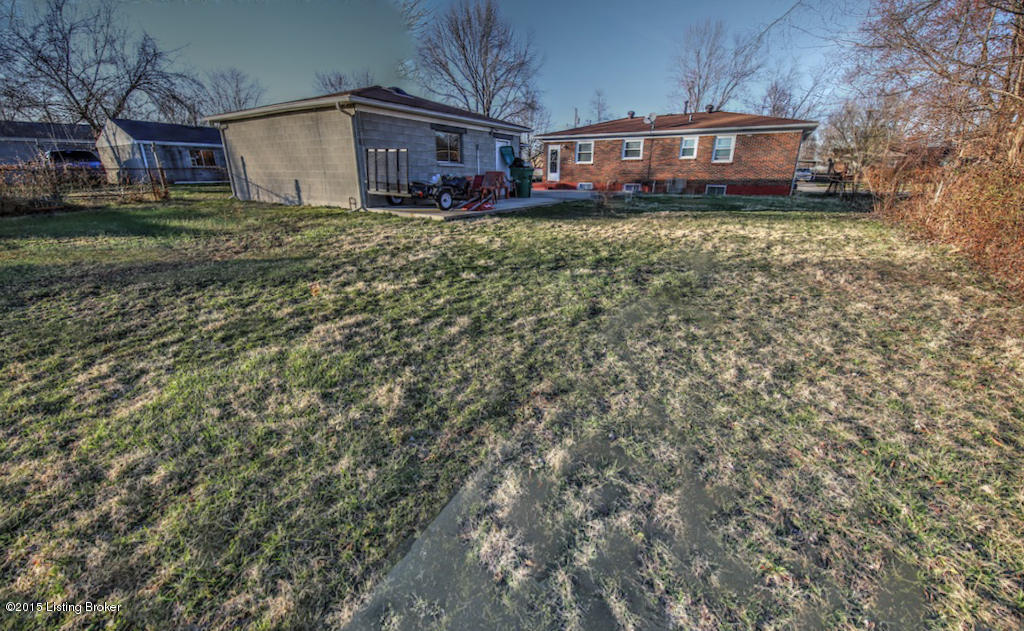 3420 Sumac Road Louisville, KY 40216 - Photo 22 of 22 Back yard looking toward the home. Garage on left