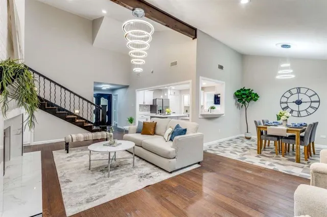 a living room with furniture and a painting