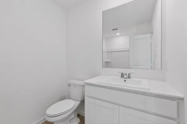 a white bath tub sitting next to a shower