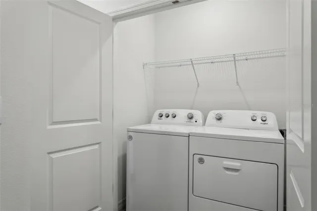 a view of a back yard from a balcony