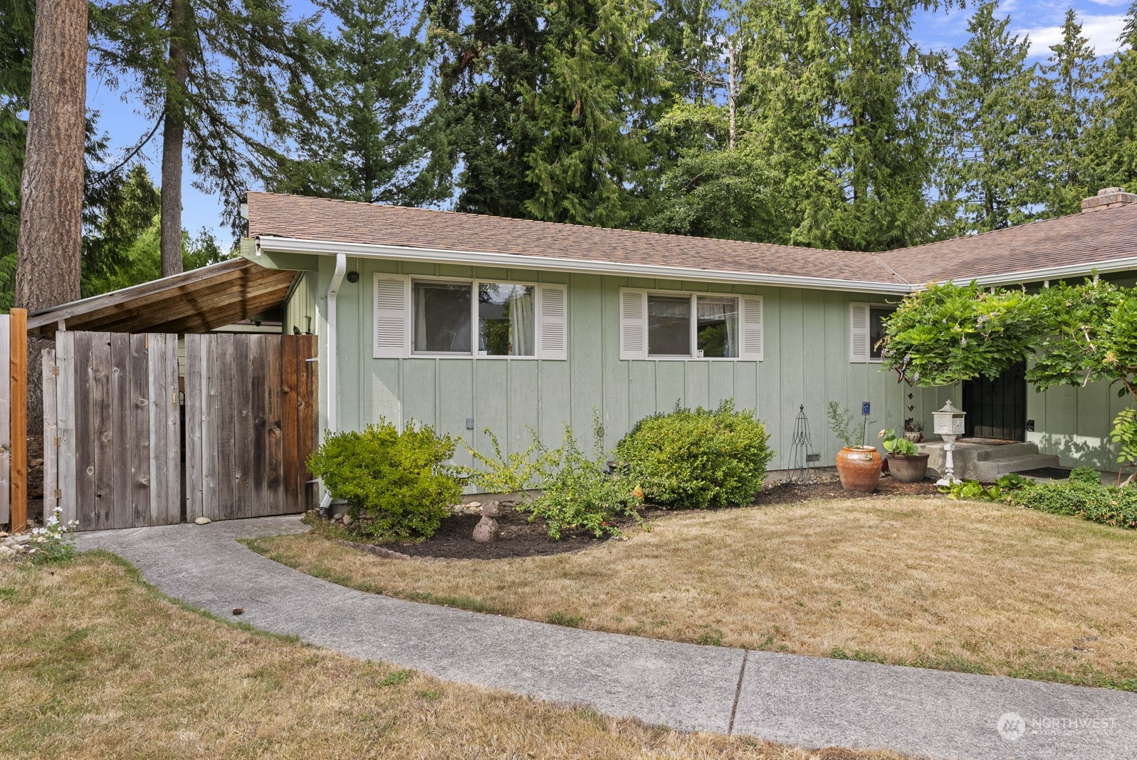 2103 Timber Trail Bothell, WA 98012 - Photo 12 of 40 a front view of a house with garden