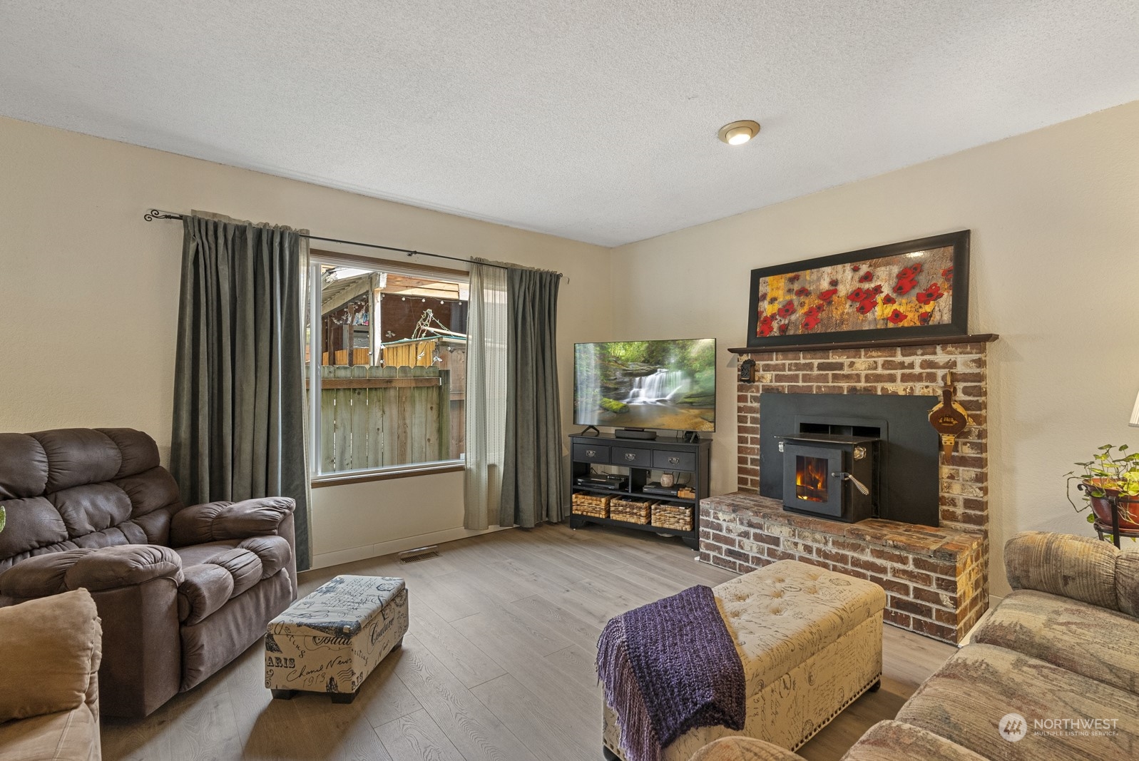 2103 Timber Trail Bothell, WA 98012 - Photo 14 of 40 a living room with furniture and a fireplace