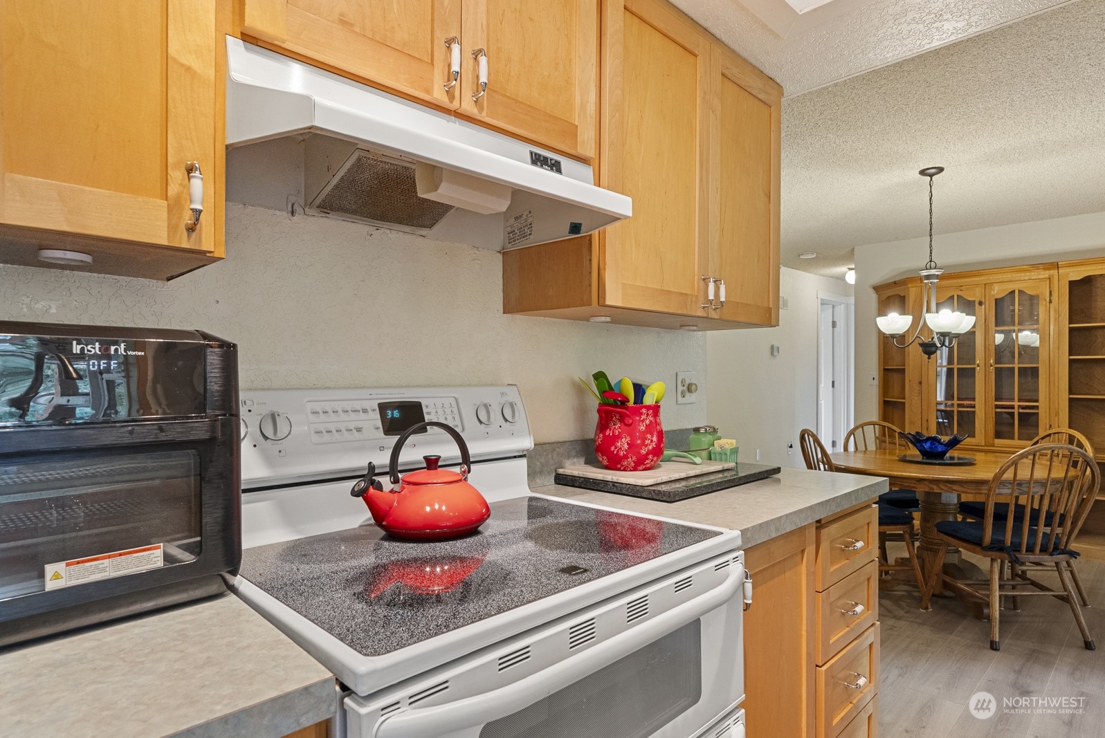 2103 Timber Trail Bothell, WA 98012 - Photo 20 of 40 a kitchen with a stove and cabinets