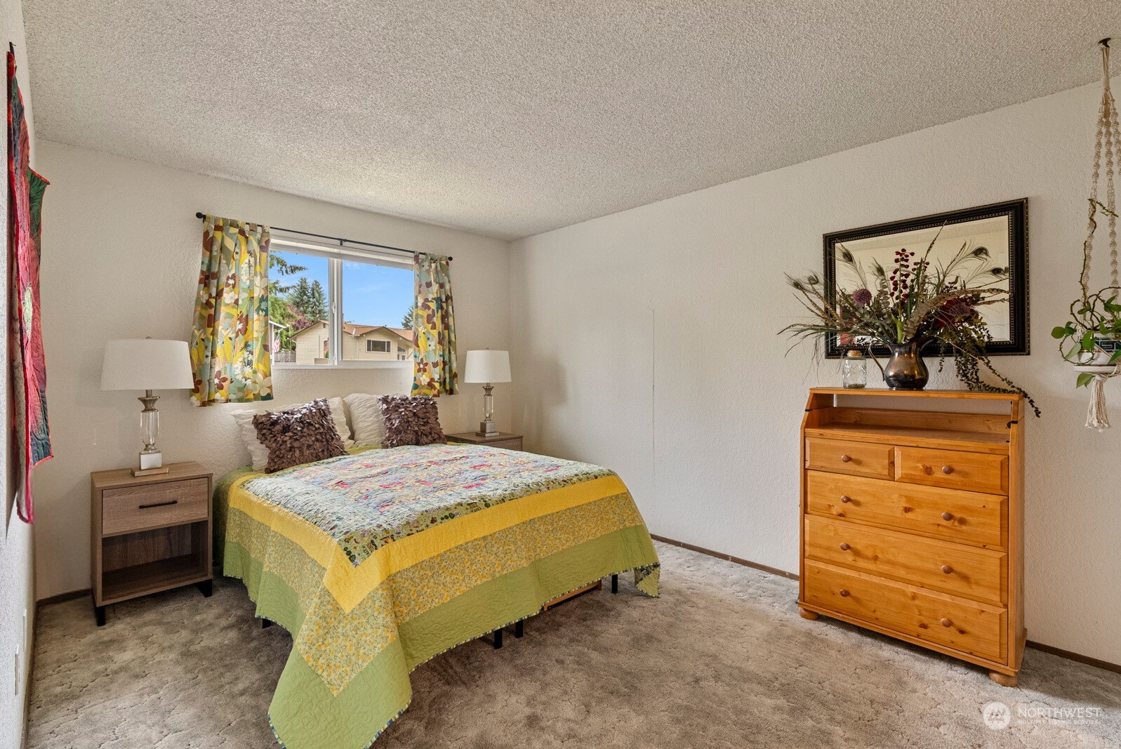 2103 Timber Trail Bothell, WA 98012 - Photo 29 of 40 a bedroom with a bed and a dresser in it
