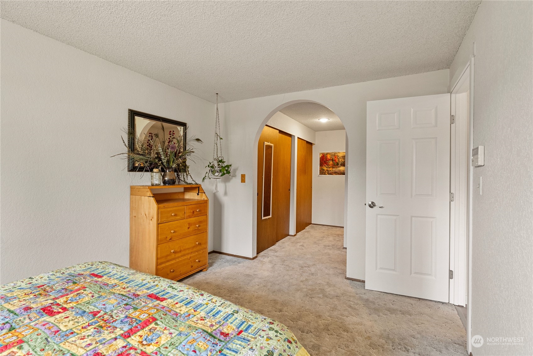 2103 Timber Trail Bothell, WA 98012 - Photo 30 of 40 a bedroom with a bed and a dresser in it