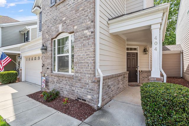 a view of brick house with a large windows