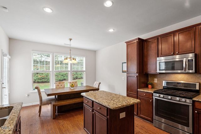 a kitchen with a stove and a microwave