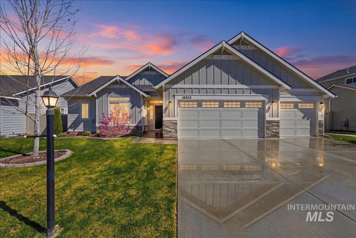 16202 Dietz Way Caldwell, ID 83607 - Photo 1 of 31 Craftsman inspired home featuring board and batten siding, stone siding, an attached garage, and concrete driveway