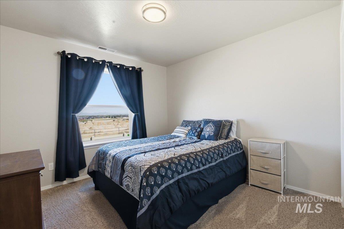 16202 Dietz Way Caldwell, ID 83607 - Photo 17 of 31 Carpeted bedroom featuring baseboards