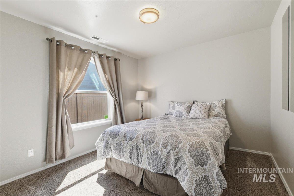 16202 Dietz Way Caldwell, ID 83607 - Photo 18 of 31 Carpeted bedroom with baseboards