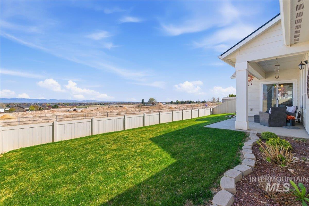 16202 Dietz Way Caldwell, ID 83607 - Photo 24 of 31 Fenced backyard with a patio area