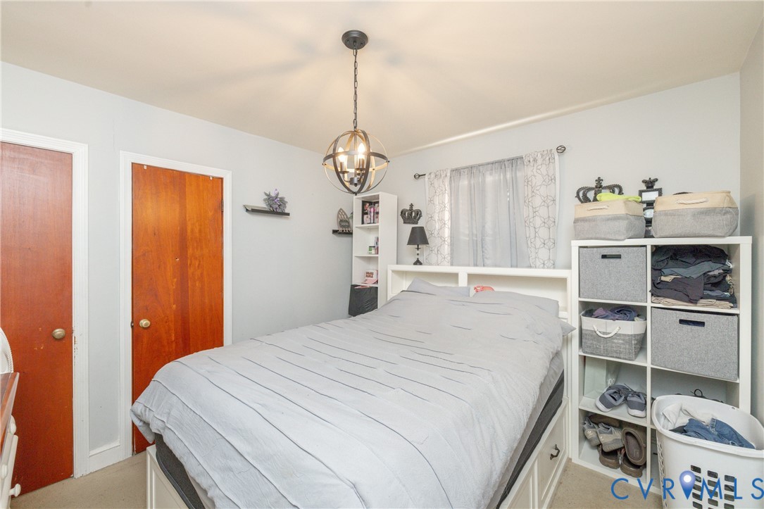 24601 Callear Road Petersburg, VA 23803 - Photo 11 of 32 a bedroom with a bed and a window