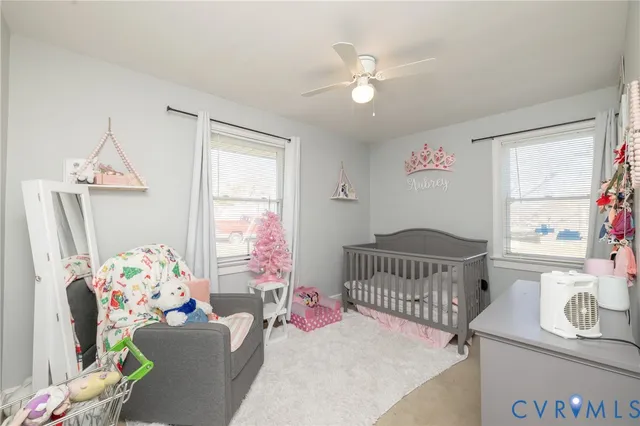 a bedroom with furniture and a window