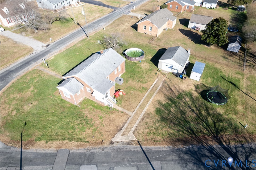 24601 Callear Road Petersburg, VA 23803 - Photo 32 of 32 an aerial view of a house with a swimming pool