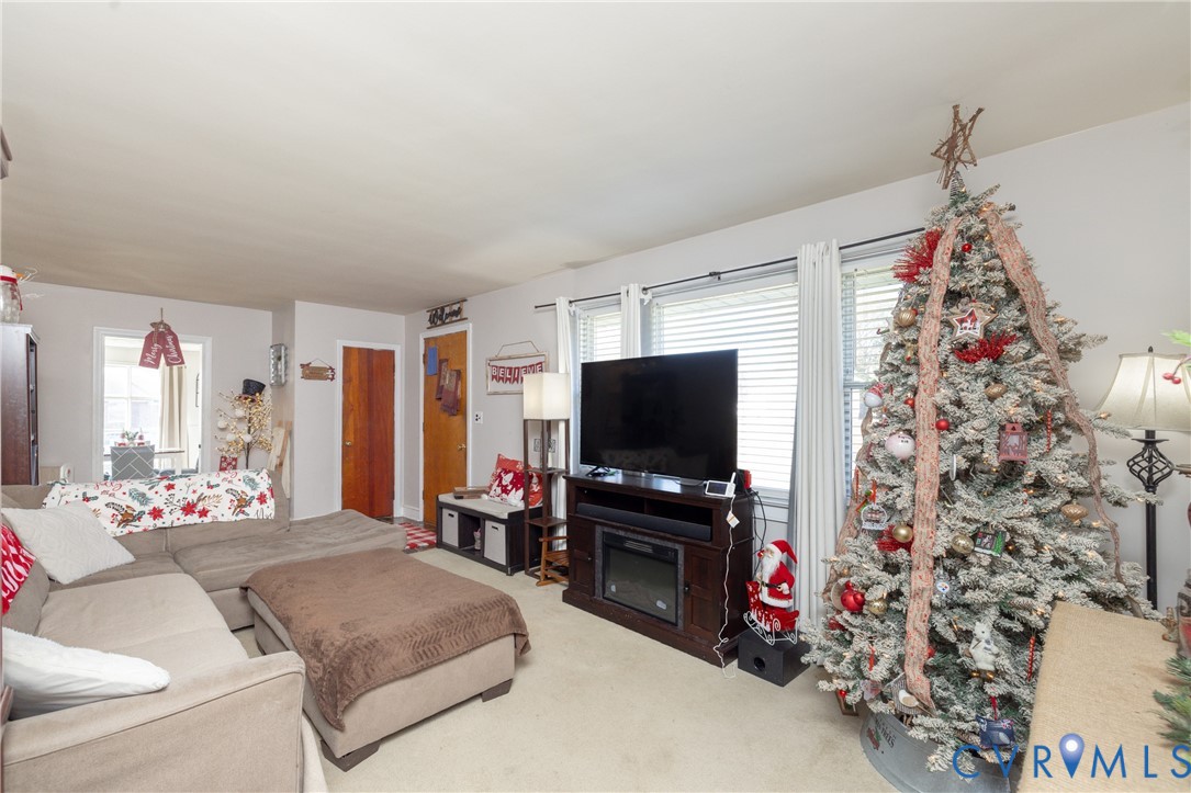 24601 Callear Road Petersburg, VA 23803 - Photo 5 of 32 a living room with furniture and a flat screen tv