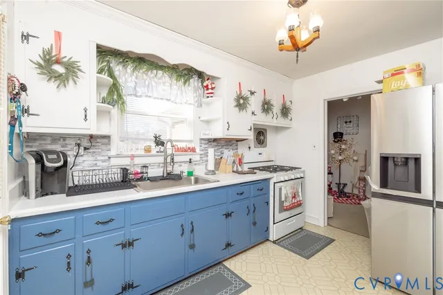 a kitchen with cabinets and window