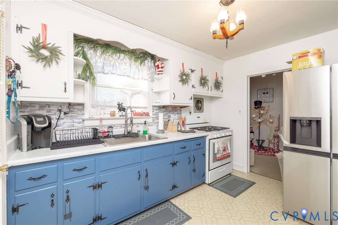 24601 Callear Road Petersburg, VA 23803 - Photo 9 of 32 a kitchen with cabinets and window