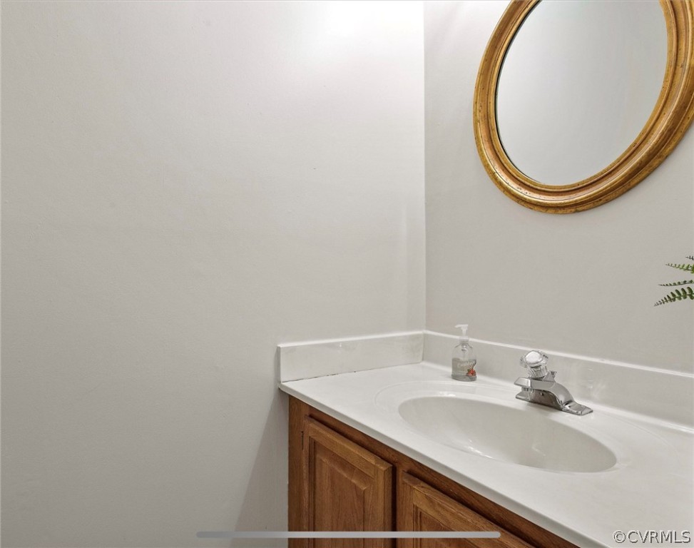 2804 Cove Ridge Road Midlothian, VA 23112 - Photo 12 of 28 a bathroom with a sink and a mirror