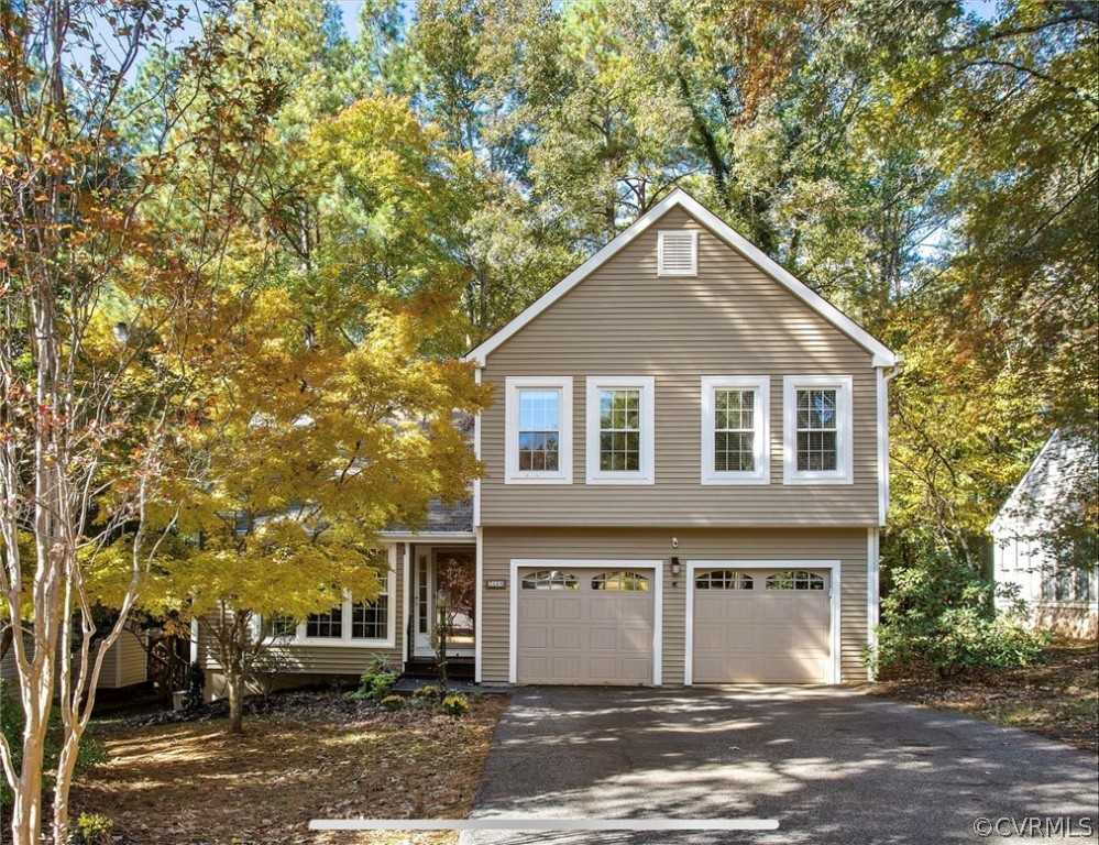 2804 Cove Ridge Road Midlothian, VA 23112 - Photo 2 of 28 a front view of a house with a yard and garage