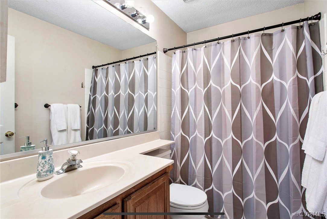 2804 Cove Ridge Road Midlothian, VA 23112 - Photo 24 of 28 a bathroom with a sink and a mirror