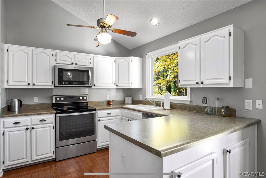 2804 Cove Ridge Road Midlothian, VA 23112 - Photo 6 of 28 a kitchen with stainless steel appliances granite countertop a sink a stove a microwave and cabinets