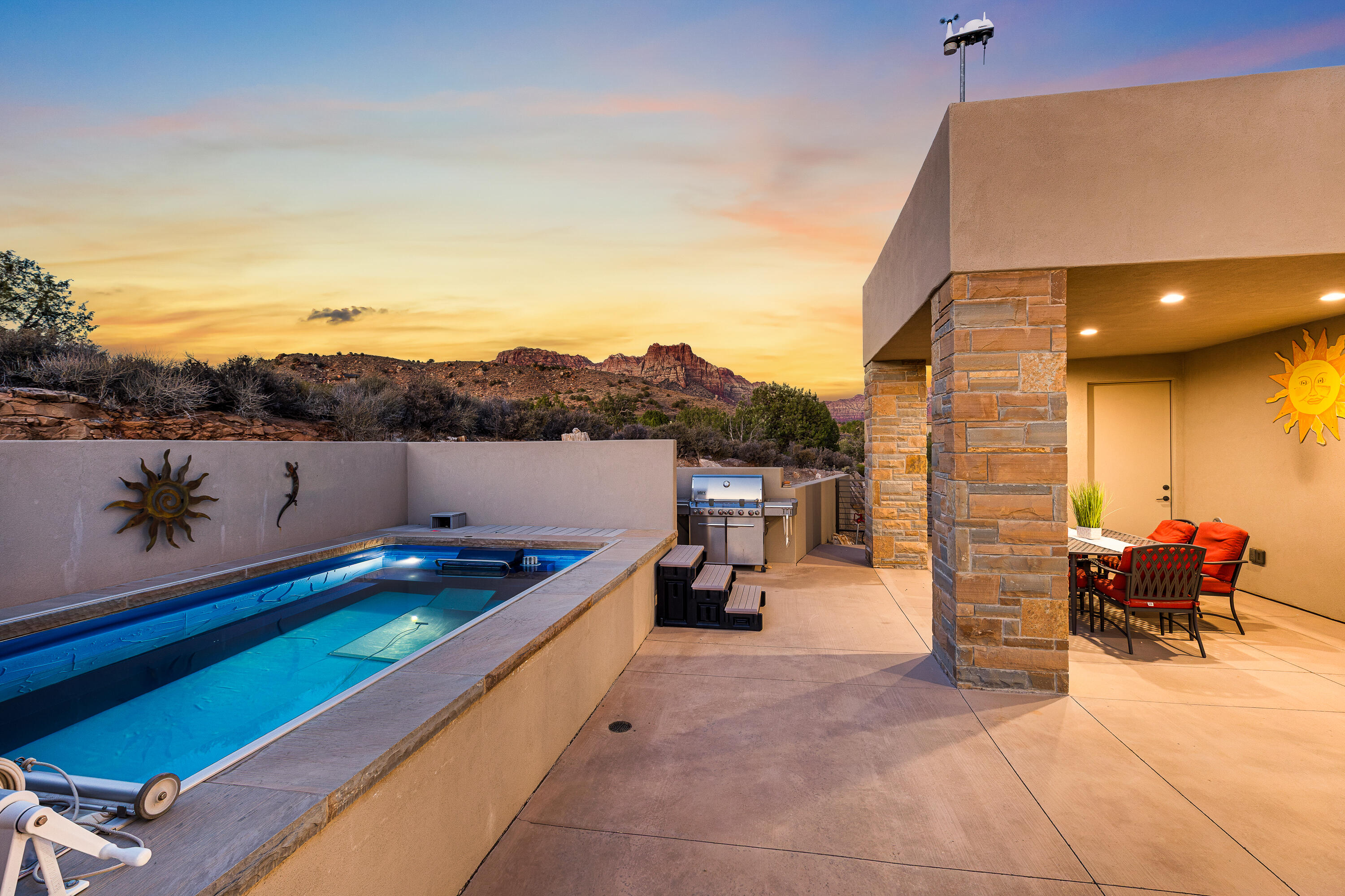 3000 Navajo Way Springdale, UT 84767 - Photo 41 of 63 Endless Pools Swim Spa shown alongside the covered patio and outdoor living space, with cliff views beyond.