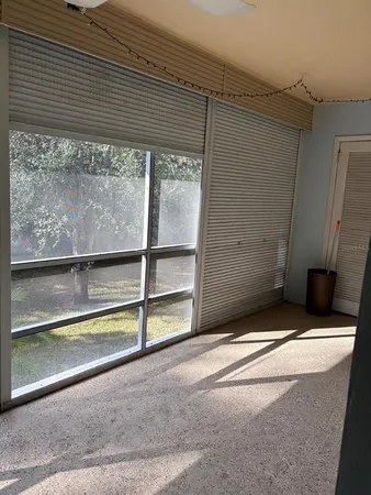 a view of an empty room with a window