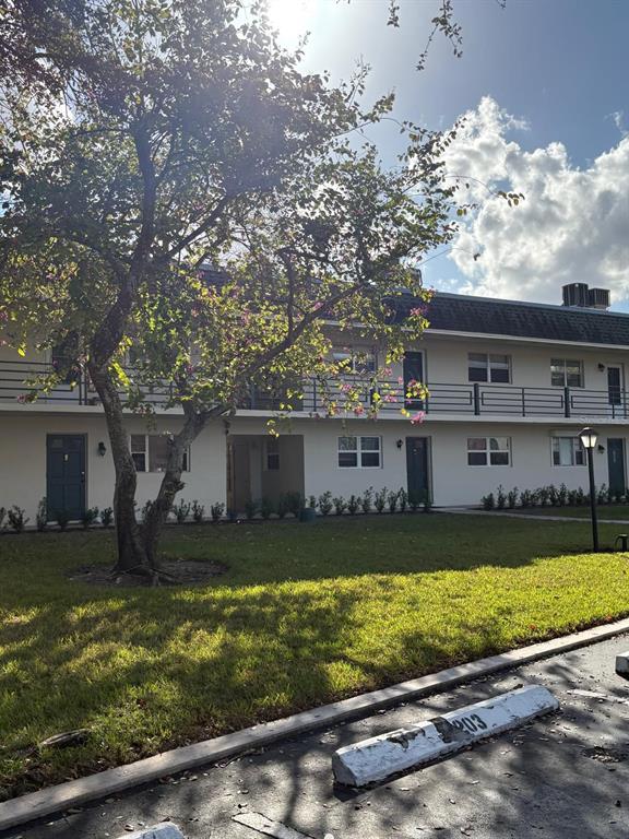 1900 South Kanner Highway, Unit 5204 Stuart, FL 34994 - Photo 25 of 25 front view of house with a yard