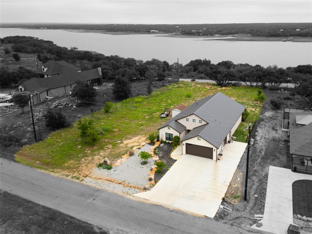 aerial view of a house with a lake view