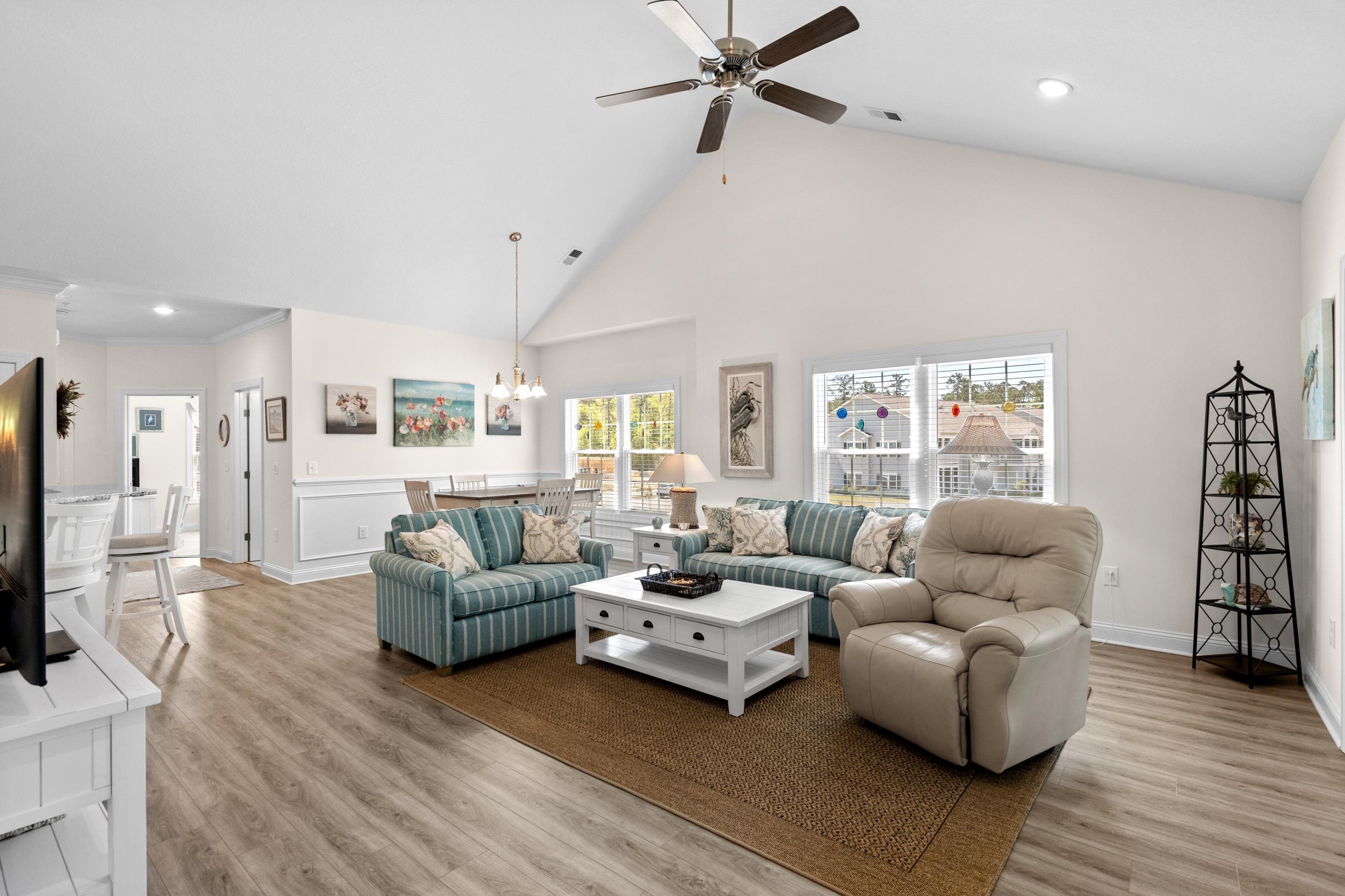 948 Jackline Place, Unit 201 Murrells Inlet, SC 29576 - Photo 11 of 37 Living room featuring high vaulted ceiling, light wood-style floors, recessed lighting, ceiling fan, and a chandelier