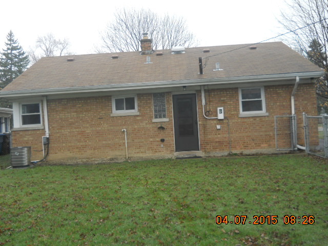 17560 Howe Avenue Homewood, IL 60430 - Photo 3 of 9 a front view of a house with a garden