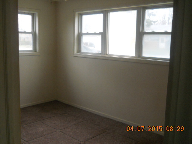 17560 Howe Avenue Homewood, IL 60430 - Photo 7 of 9 an empty room with a window