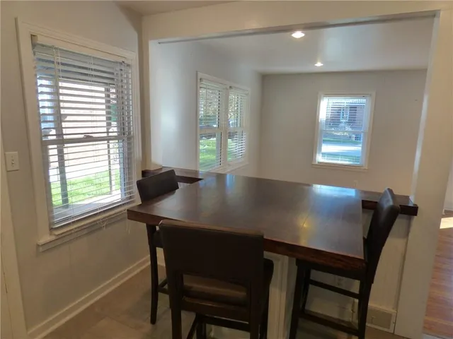 a view of a dining room with furniture and window